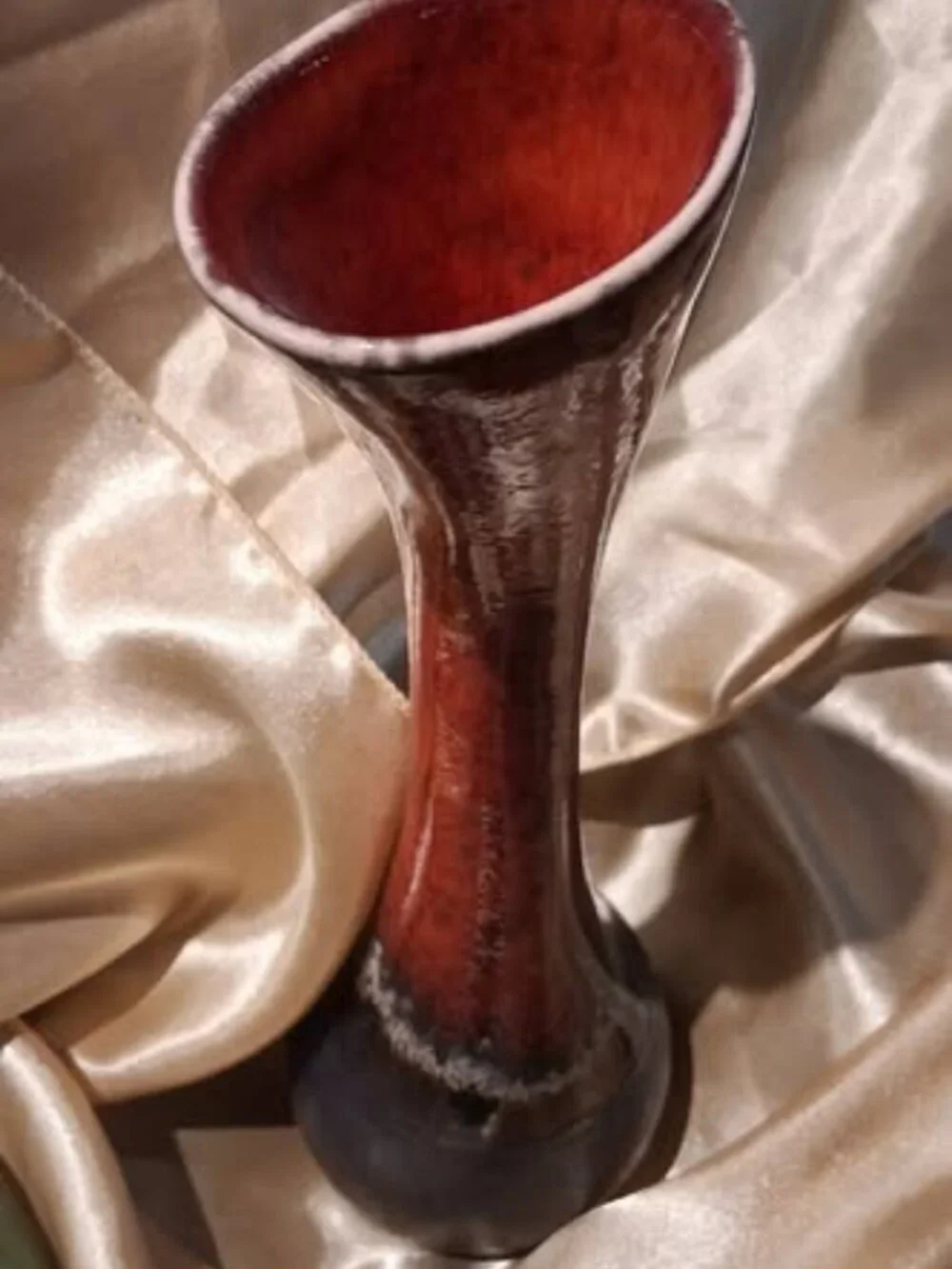 Organic, asymmetrical form paired w high-fire reactive lava/drip glazes